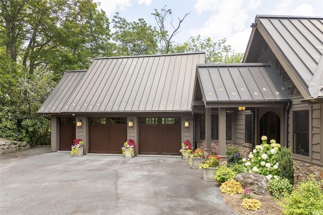 541 Summer Hill Rd, Cullowhee, NC 28723 - view of front facade featuring a standing seam roof, driveway, a metal roof, and a garage