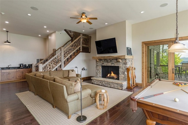541 Summer Hill Rd, Cullowhee, NC 28723 - living room with dark wood-style floors, a ceiling fan, a stone fireplace, stairway, and recessed lighting