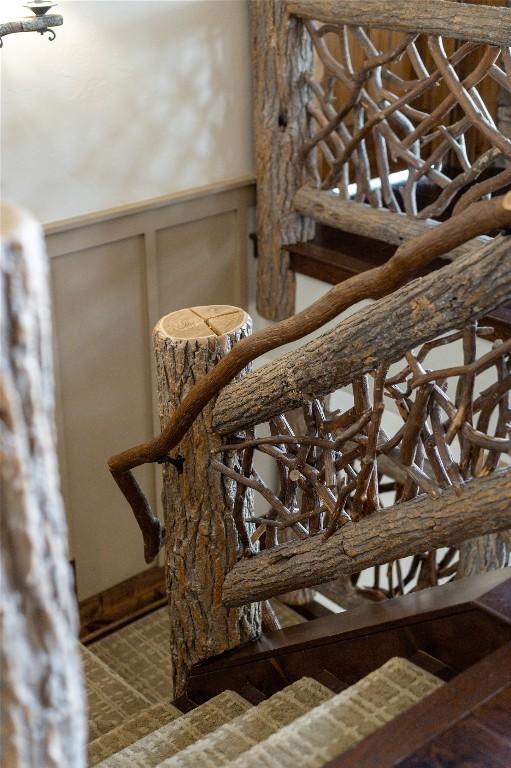 541 Summer Hill Rd, Cullowhee, NC 28723 - staircase featuring a decorative wall and a wainscoted wall