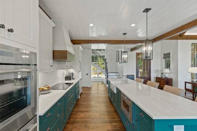 199 Springhead Trl, Cullowhee, NC 28723 - kitchen with stainless steel appliances, green cabinets, dark wood-type flooring, wooden ceiling with exposed beams, and light countertops