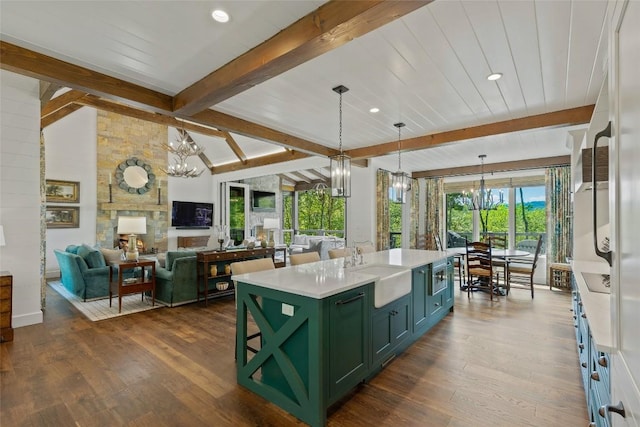 199 Springhead Trl, Cullowhee, NC 28723 - kitchen with green cabinets, a chandelier, a sink, light countertops, and dark wood-style flooring