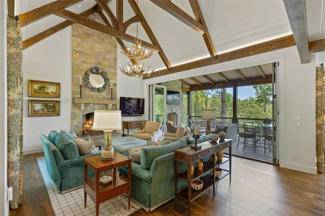 living area featuring beamed ceiling, a notable chandelier, baseboards, and hardwood / wood-style flooring
