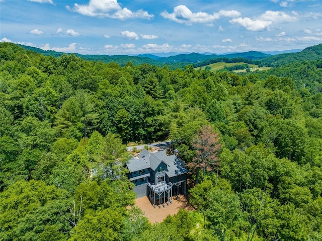 aerial view featuring a view of trees