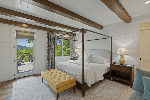 199 Springhead Trl, Cullowhee, NC 28723 - bedroom featuring wood walls, multiple windows, access to exterior, light wood-style floors, and wood ceiling with exposed beams