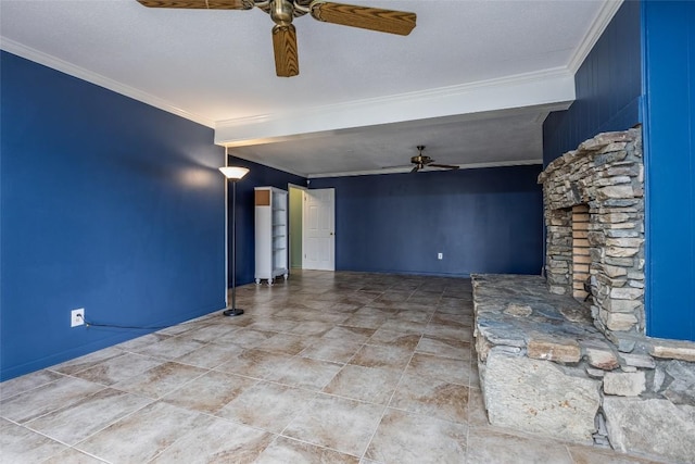 spare room with ceiling fan, a textured ceiling, baseboards, and crown molding