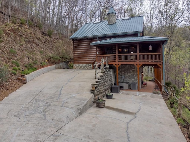 view of patio featuring stairway and central AC unit