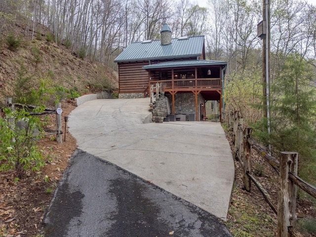 exterior space featuring concrete driveway