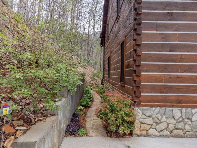 view of home's exterior with log siding