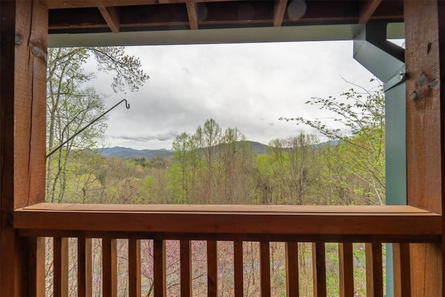 exterior space with a mountain view and a balcony