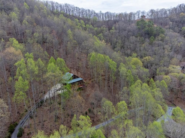 aerial view featuring a wooded view