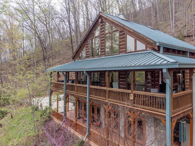 view of outbuilding featuring a wooded view
