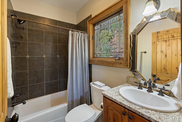 bathroom featuring shower / bath combo, vanity, and toilet