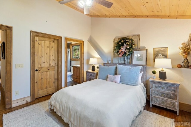 bedroom with connected bathroom, wooden ceiling, vaulted ceiling, and wood finished floors