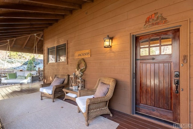 doorway to property with covered porch