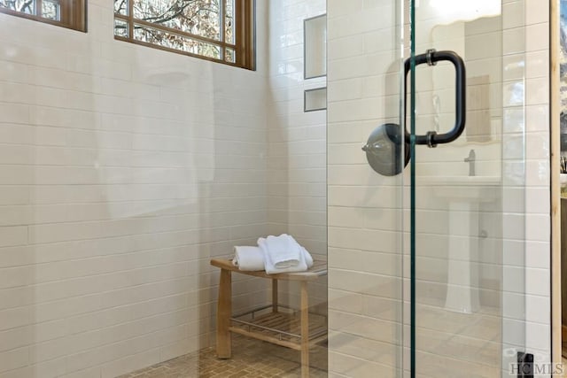 bathroom with tiled shower