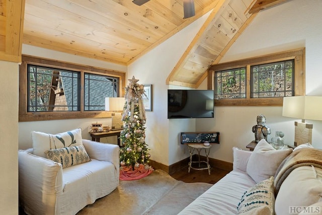 living room featuring baseboards, wood ceiling, ceiling fan, wood finished floors, and vaulted ceiling with beams