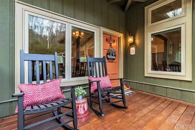 wooden terrace featuring covered porch