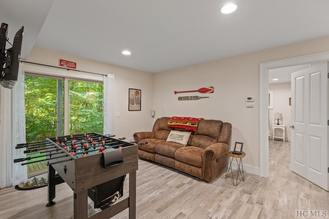 playroom with light hardwood / wood-style flooring