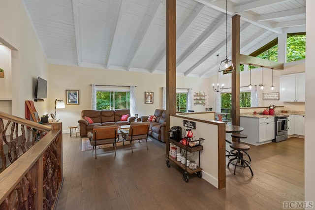 living room featuring beamed ceiling, dark hardwood / wood-style floors, high vaulted ceiling, and a notable chandelier