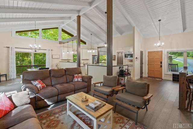 living room featuring beam ceiling, hardwood / wood-style flooring, high vaulted ceiling, and a chandelier