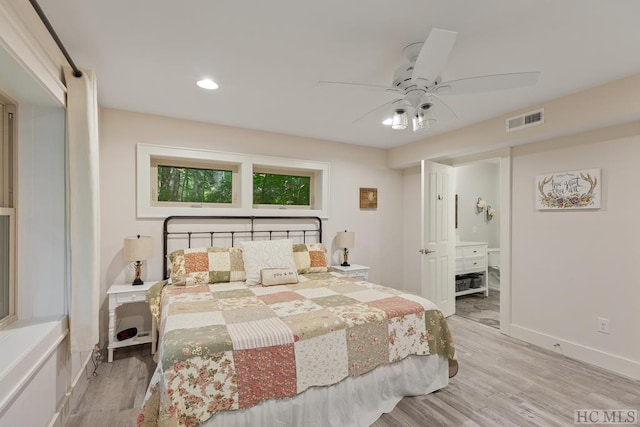 bedroom with light hardwood / wood-style floors and ceiling fan