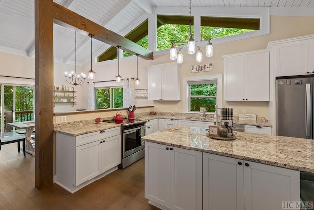 kitchen featuring dark wood-type flooring, appliances with stainless steel finishes, beam ceiling, and white cabinets