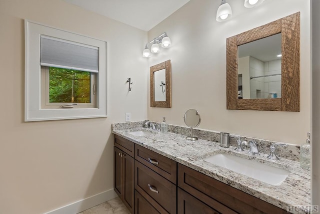 bathroom with vanity and a shower with shower door