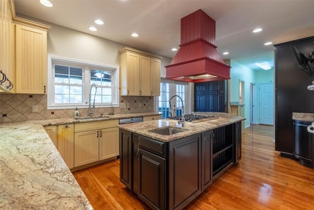 222 Notta Rd, Cullowhee, NC 28723 - kitchen with light wood finished floors, tasteful backsplash, light stone counters, island range hood, and recessed lighting