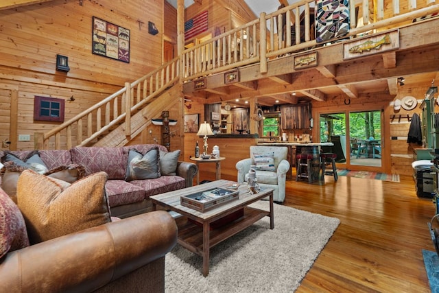 671 Walkingstick Rd, Highlands, NC 28741 - living area featuring wooden walls, a high ceiling, stairway, and wood finished floors