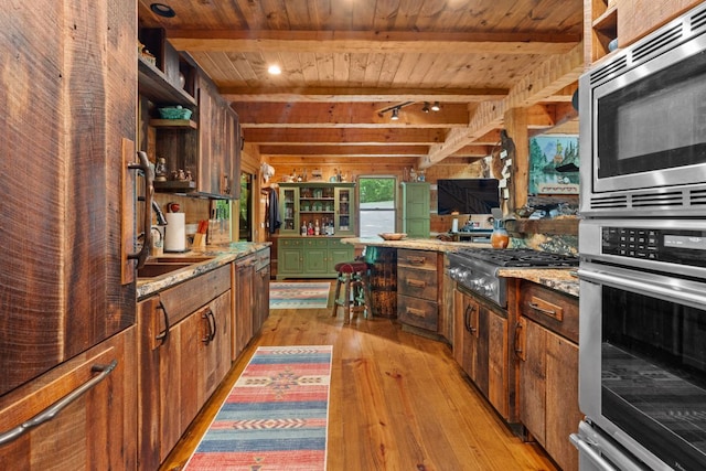 671 Walkingstick Rd, Highlands, NC 28741 - kitchen with appliances with stainless steel finishes, a wood ceiling with exposed beams, open shelves, light wood-style flooring, and light stone counters