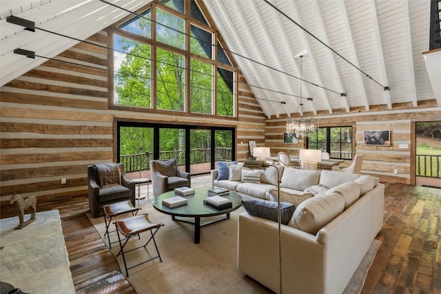 453 Bright Mountain Rd, Cullowhee, NC 28723 - living area featuring wooden walls, high vaulted ceiling, hardwood / wood-style flooring, a chandelier, and beam ceiling