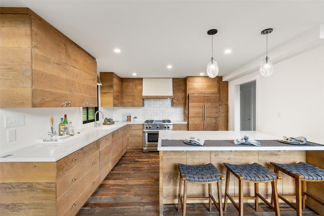 453 Bright Mountain Rd, Cullowhee, NC 28723 - kitchen with stainless steel range with gas stovetop, dark wood-type flooring, a kitchen bar, custom range hood, and a sink