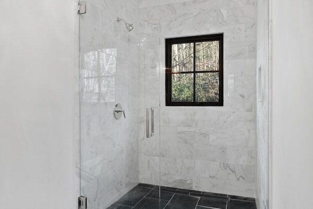 bathroom featuring an enclosed shower and tile patterned flooring