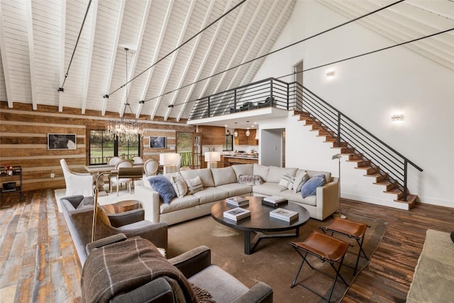 453 Bright Mountain Rd, Cullowhee, NC 28723 - living area with high vaulted ceiling, wood finished floors, wooden walls, stairs, and beamed ceiling