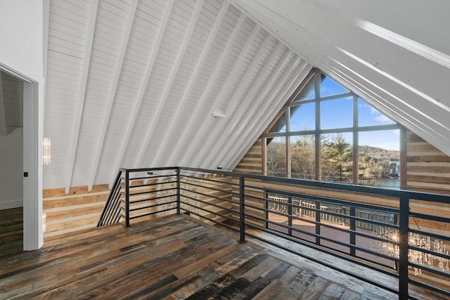 additional living space with lofted ceiling and dark hardwood / wood-style flooring