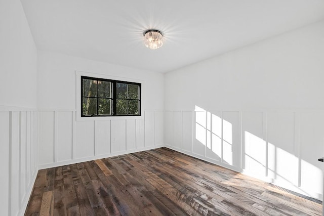 empty room featuring dark wood-type flooring