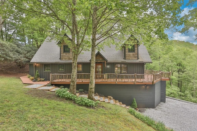 453 Bright Mountain Rd, Cullowhee, NC 28723 - rear view of house with board and batten siding, a deck, a shingled roof, and a yard