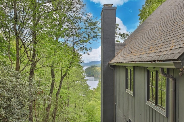 453 Bright Mountain Rd, Cullowhee, NC 28723 - view of side of property featuring a chimney, a water view, and roof with shingles