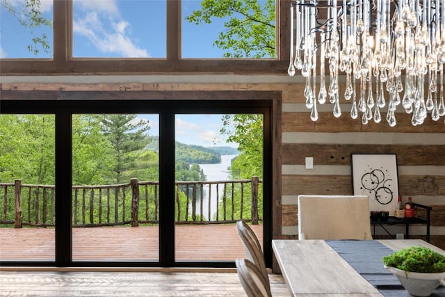 453 Bright Mountain Rd, Cullowhee, NC 28723 - dining space with a water view, plenty of natural light, and wood walls