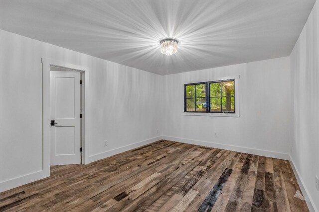 453 Bright Mountain Rd, Cullowhee, NC 28723 - spare room featuring wood finished floors and baseboards