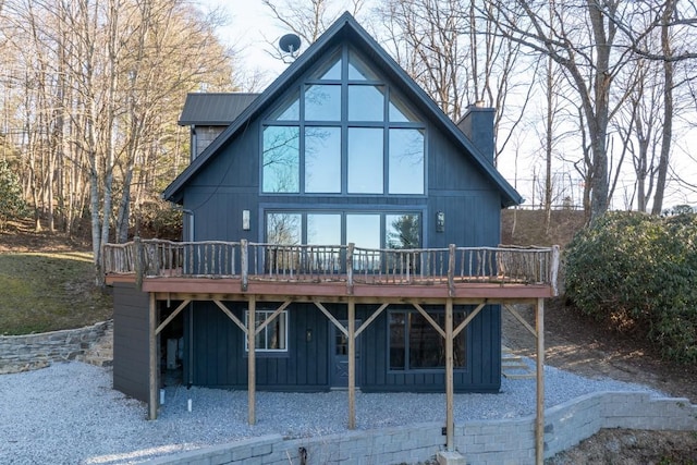 back of house featuring a wooden deck