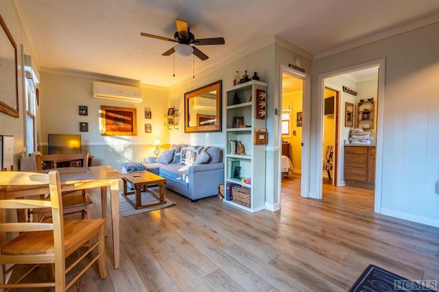 living room with ornamental molding, light hardwood / wood-style flooring, a wall mounted AC, and ceiling fan