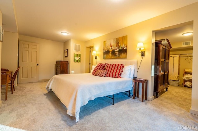 carpeted bedroom with a closet