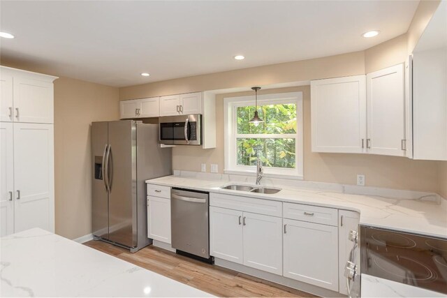19 Indian Falls Way, Lake Toxaway, NC 28747 - kitchen with stainless steel appliances, a healthy amount of sunlight, a sink, and a peninsula