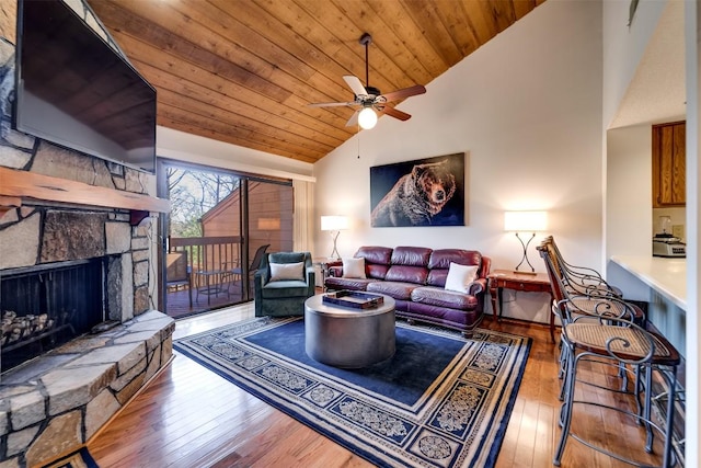 living area with a fireplace, wooden ceiling, high vaulted ceiling, a ceiling fan, and wood-type flooring