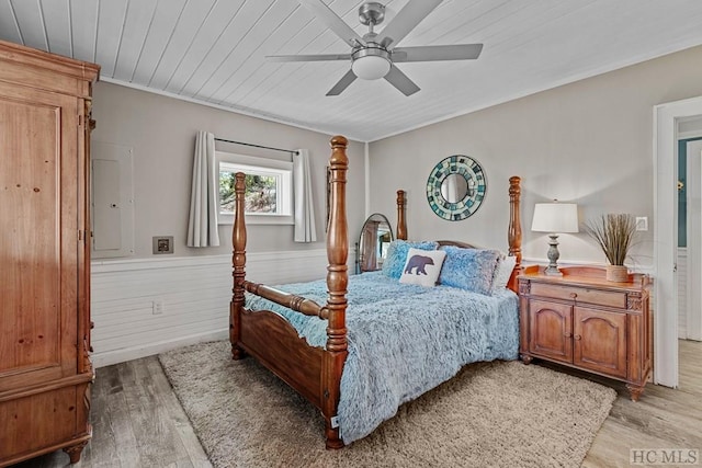 bedroom with wood ceiling, ceiling fan, and light hardwood / wood-style flooring