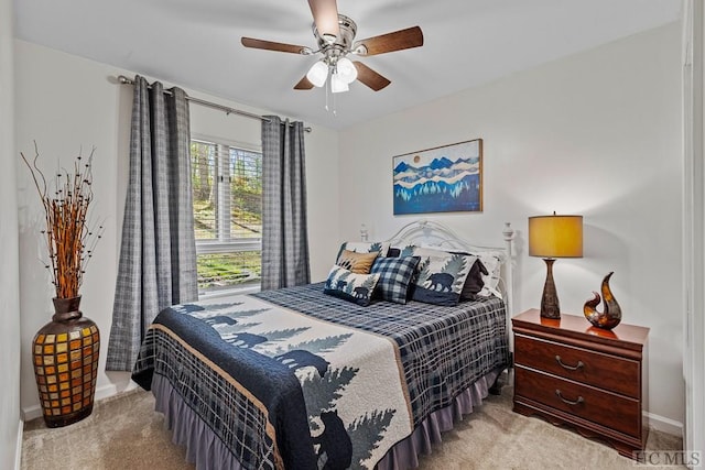 bedroom with light colored carpet and ceiling fan