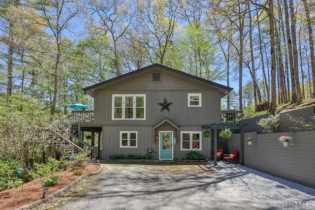 front of property with a wooden deck