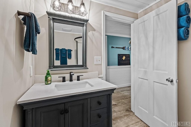 bathroom featuring vanity, a notable chandelier, and hardwood / wood-style flooring