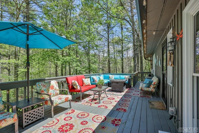 wooden deck featuring an outdoor hangout area